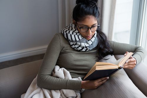 Woman With a Blanket Reading a Book