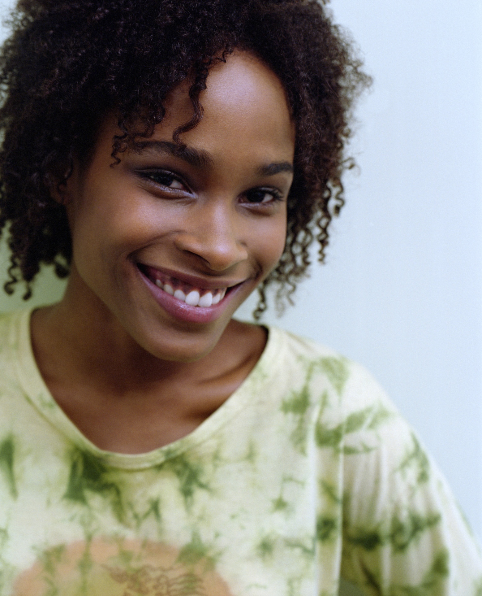 African-American woman smiling.