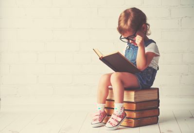 Young Girl Reading a Book