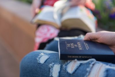 Young Person With one of the primary texts of mormonism