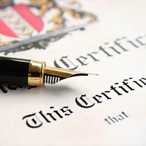 A zoomed in photo of a fountain pen on a marriage license