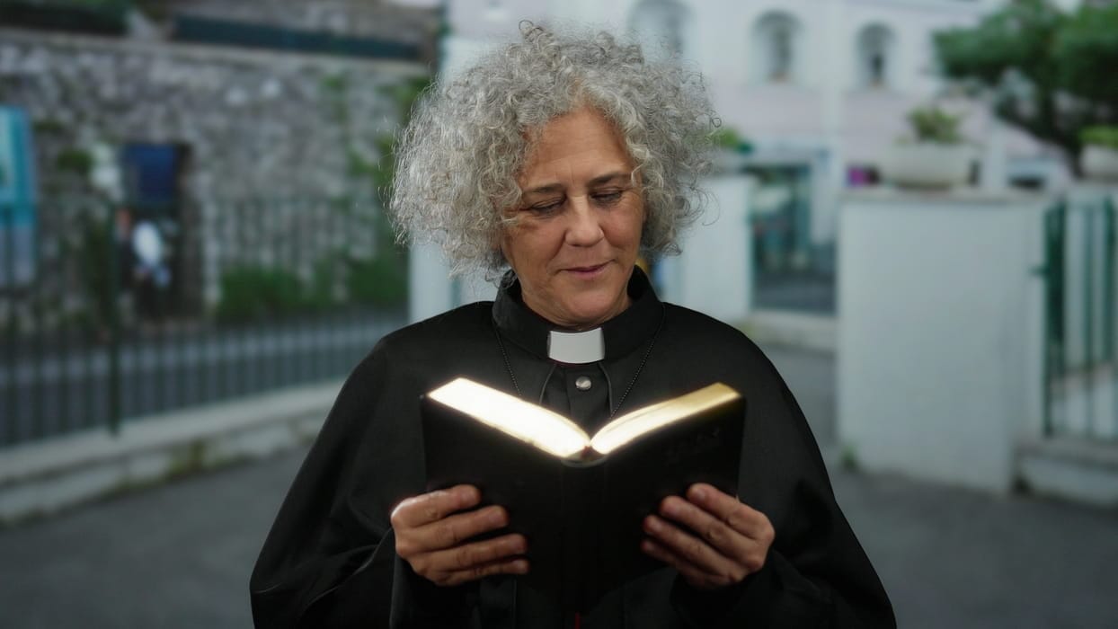 A minister reading from the Bible