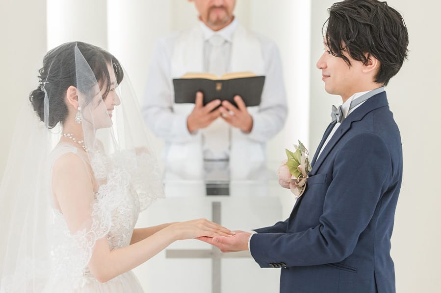 A wedding ceremony being held inside a church.