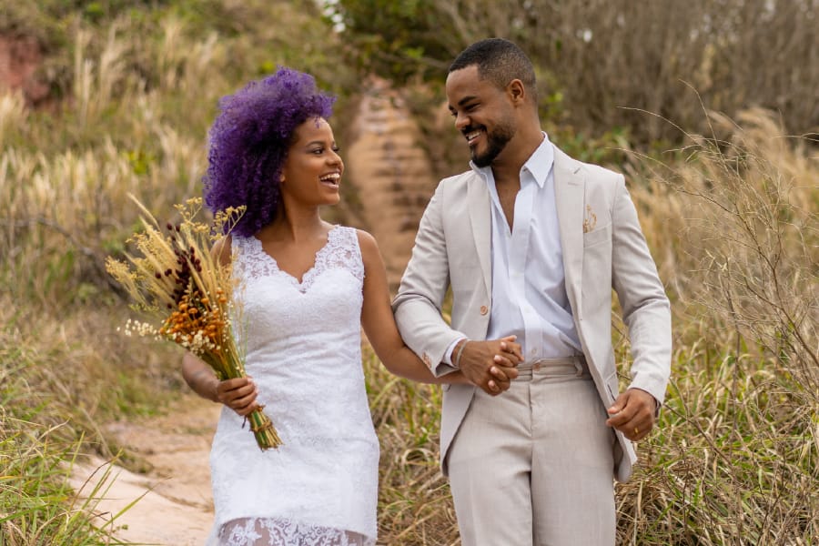 Newlywed brides embracing after humanist wedding ceremony