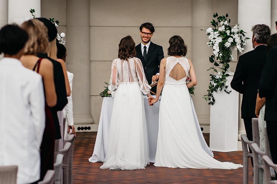 A couple at the end of the aisle about to be wed.