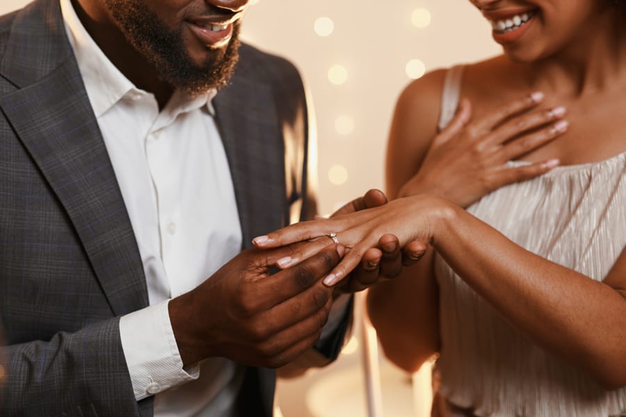 Happy bride and groom during wedding ceremony ring exchange