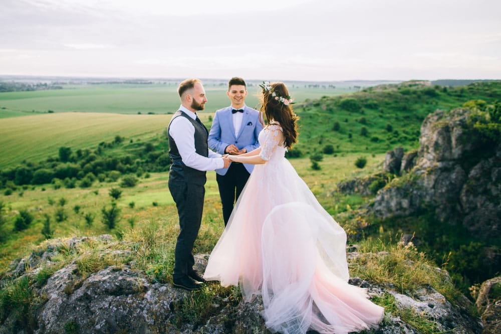 Officiant performing simple outdoor wedding 