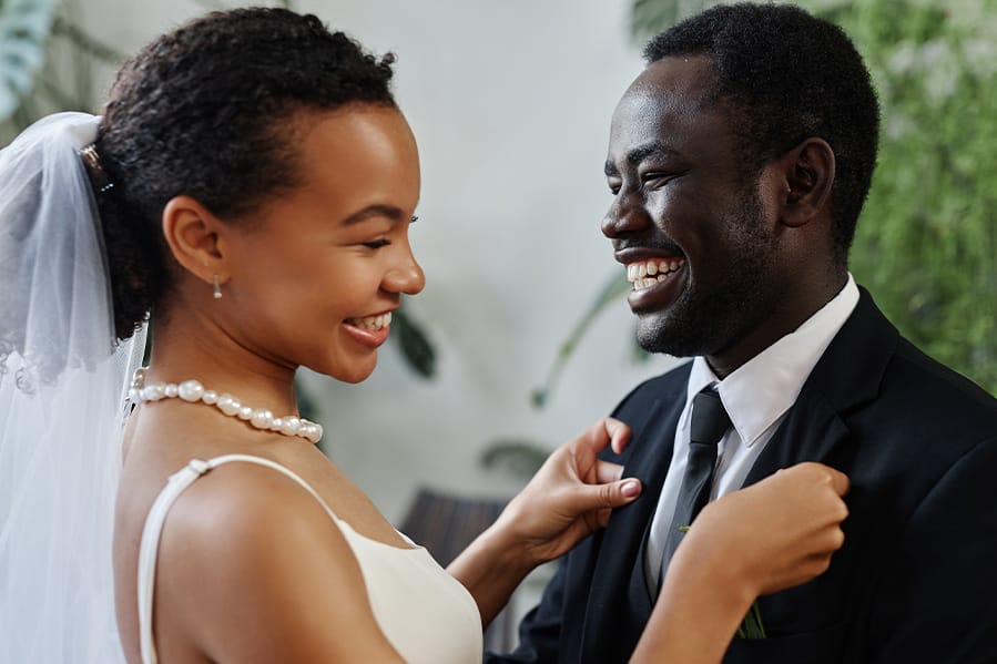 A smiling bride and groom celebrating their milestone.