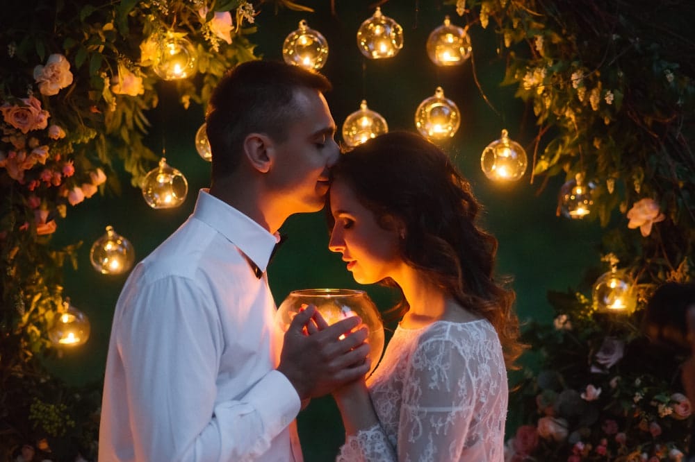 Wiccan couple embracing after Pagan wedding